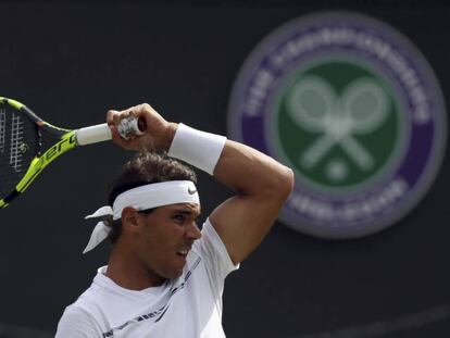 Spain's Rafael Nadal returns to Australia's John Millman during their Men's Singles Match on day one at the Wimbledon Tennis Championships in London Monday, July 3, 2017. (AP Photo/Tim Ireland)