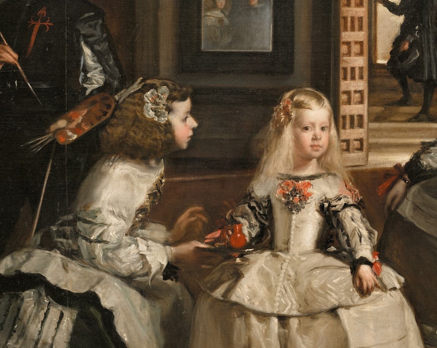 La menina dándole el bucarito a la infanta Margarita en 'Las Meninas' de Velázquez.