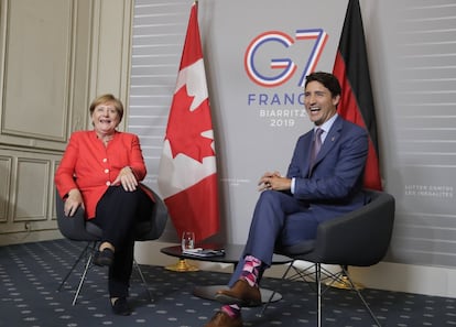 La canciller alemana, Angela Merkel, junto al primer ministro de Canadá, Justin Trudeau, durante la segunda jornada del G7, este domingo.