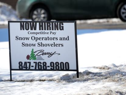 A hiring sign is displayed in Arlington Heights, Ill., Sunday, Feb. 5, 2022. On Thursday, the Labor Department reports on the number of people who applied for unemployment benefits last week.