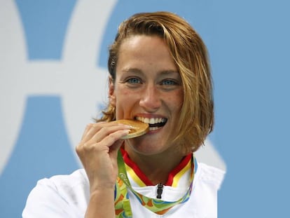 Mireia Belmonte with her Olympic gold medal in the 200 meter butterfly