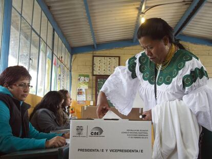 A woman votes in the 2013 general elections.