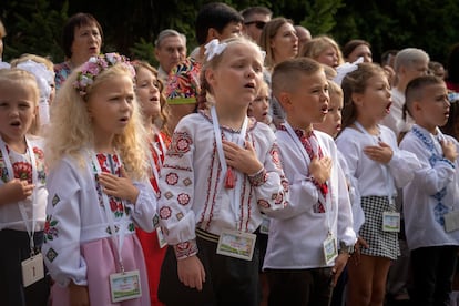 Schoolgirls attend a ceremony of the first day in school in Bucha, Ukraine