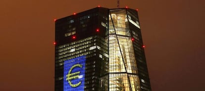 Headquarters of the European Central Bank (ECB) are illuminated with a giant euro sign at the start of the "Luminale, light and building" event in Frankfurt