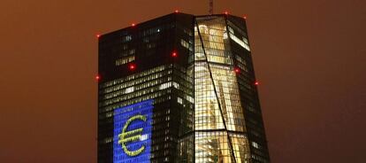 Headquarters of the European Central Bank (ECB) are illuminated with a giant euro sign at the start of the "Luminale, light and building" event in Frankfurt