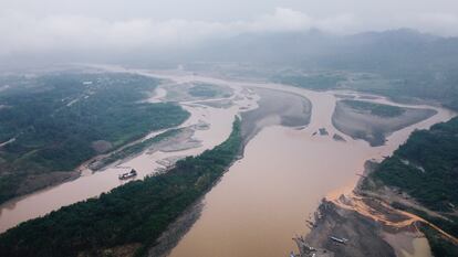 An aerial view of the Kaka River, on the shores of the town of Mayaya; a tributary of the river appears reddish as a result of gold panning by a Chinese company. 