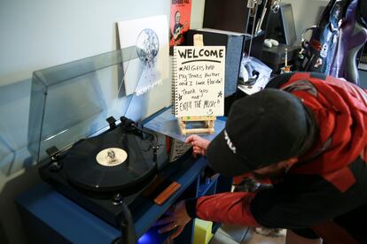 Eli sets up his record player at his home in Casselberry, Fla. on May 29, 2023.