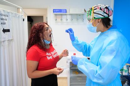 A woman is given a PCR test in Usera, Madrid.