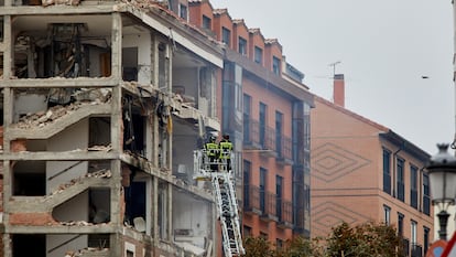 Firefighters inspecting the damage to the building, which authorities said may undergo controlled demolition at a later date. 