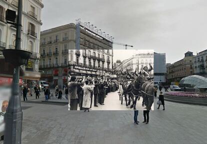 Republican soldiers give clenched fist salutes in the Puerta del Sol.