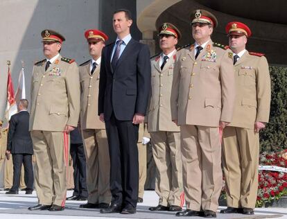 Bachar el Asad, junto al asesinado Rajha (derecha).