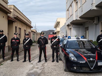 Italian police officers guard the street leading to Mattelo Messina's home in Campobello di Mazzara.