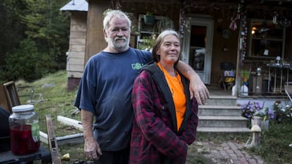 Randy and Alma McNeely outside their house in McDowell County.