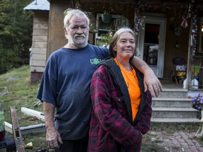 Randy and Alma McNeely outside their house in McDowell County.