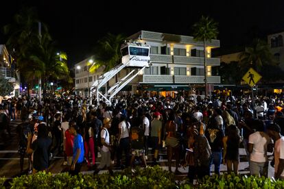 Crowds gather at Ocean Drive and 8th during spring break on Saturday, March 18, 2023, in Miami Beach, Fla.