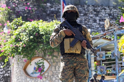 A police officer standing guard outside the presidential residence after the assassination of Jovenel Moïse on July 7.