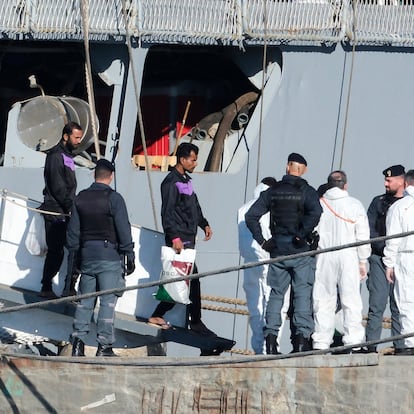 Migrants disembark from the Italian navy ship Libra at the port of Shengjin, northwestern Albania, Friday, Nov. 8, 2024, as a second group of eight migrants were intercepted in international waters is processed in a reception facility despite the failure with the first group in October. (AP Photo/Vlasov Sulaj)