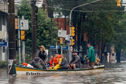 Volunteer rescuers navigate the flooded streets in Porto Alegre (Brazil).