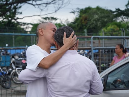 A man hugs his family as he leaves prison in Guayaquil, Ecuador, May 10, 2024.