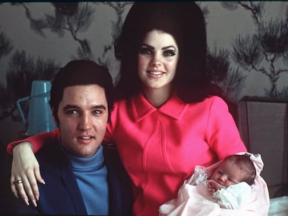 Elvis Presley poses with wife Priscilla and daughter Lisa Marie, in a room at Baptist hospital in Memphis, Tenn., on February 5, 1968. 