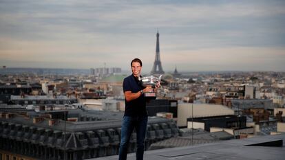 Spain's Rafael Nadal poses with his trophy during a photo call on the rooftop of Galeries Lafayette, Monday, Oct. 12, 2020, after winning Sunday the final match of the French Open tennis tournament against Serbia's Novak Djokovic in three sets, 6-0, 6-2, 7-5 at the Roland Garros stadium. (AP Photo/Francois Mori)