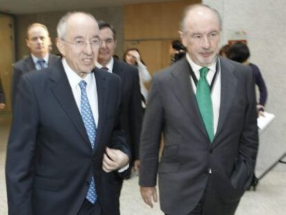 El exgobernador del Banco de España, Miguel Ángel Fernández Ordóñez, y el expresidente de Bankia, Rodrigo Rato en una jornada financiera en 2010.