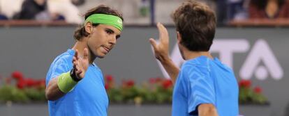 Rafael Nadal y Marc López celebran un punto en el torneo de Indian Wells.