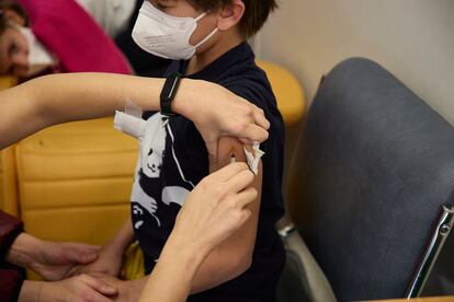 A child receives a dose of the Covid-19 vaccine in La Paz hospital in Madrid.