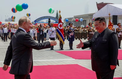 Russian President Vladimir Putin and North Korea's leader Kim Jong-un shake hands during the official welcome ceremony in the Kim Il Sung Square in Pyongyang, North Korea, on Wednesday, June 19, 2024.