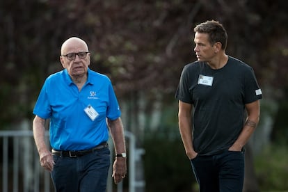 Rupert Murdoch and his son Lachlan Murdoch walk together, on July 13, 2017, in Sun Valley, Idaho.