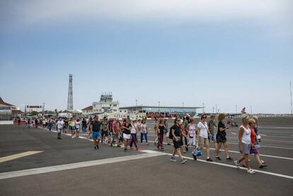 Visitors cross the airport of Gibraltar.