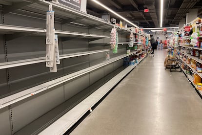 Shelves stand empty of bottle water following a chemical spill into the Delaware River upstream from Philadelphia, Tuesday, March 28, 2023.