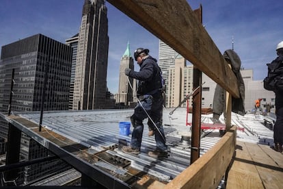 A construction worker on a new building in the financial district of Manhattan, New York, in April 2023.