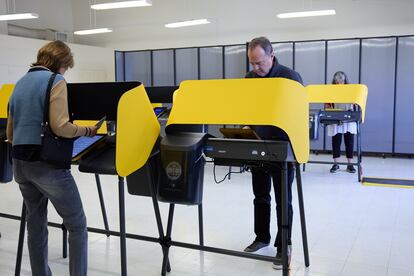 Congressman Adam Schiff, right, votes Tuesday in Burbank, California.