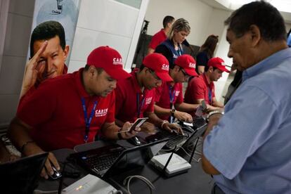 Cadivi officials check an airline passenger at Simón Bolívar International Airport in Maquetía.