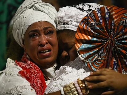 Two women cry at a demonstration held in memory of Mãe Bernadete Pacifico, in São Paulo, Brazil, on August 17, 2023.