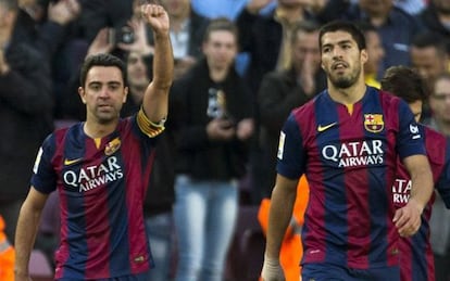 Xavi Hernández i Luis Suárez, a l'abril.