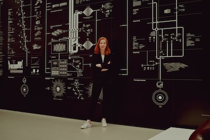 Kate Crawford in front of 'Anatomy of an AI system', the work she created with artist Vladan Joler.