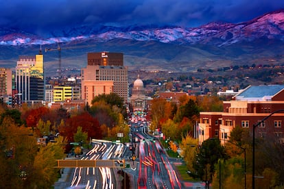 Downtown Boise Idaho at sunset with fresh snow on foothills, viewed from Depot Hill.