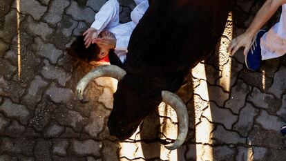 A reveller participates in the running of the bulls at the San Fermin festival in Pamplona, Spain, July 8, 2024. REUTERS/Susana Vera