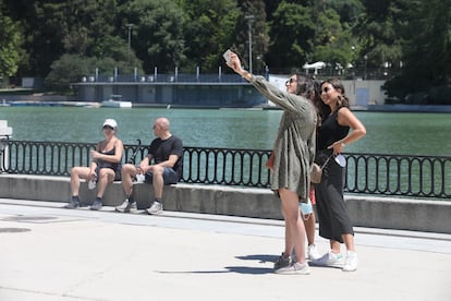 People gather in El Retiro park in Madrid on Thursday.