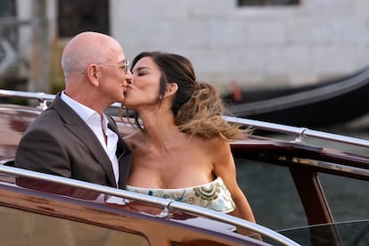 Jeff Bezos, left, and Lauren Sanchez kiss as they leave a hotel for their pre wedding reception, in Venice, Italy, Thursday, June 26, 2025. (AP Photo/Luca Bruno)
Associated Press/LaPresse