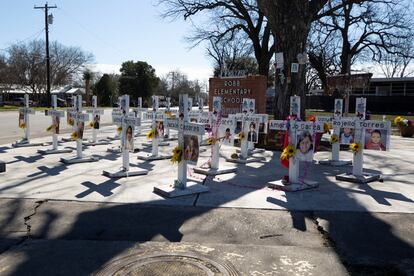 Memorial crosses stand in front of Robb Elementary School, as U.S. Attorney General Merrick Garland