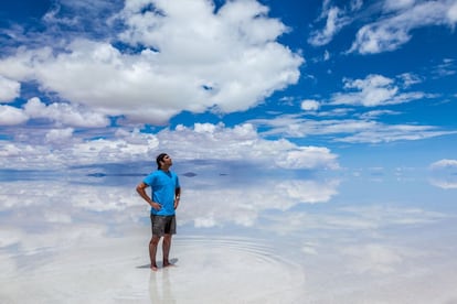 Man standing in the Salar de Uyuni, february, Bolivia