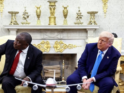 FILE PHOTO: U.S. President Donald Trump and South African President Cyril Ramaphosa looks towards a monitor (not pictured) that shows videos allegedly pertaining to the genocide of white people in South Africa, in the Oval Office of the White House in Washington, D.C., U.S., May 21, 2025. REUTERS/Kevin Lamarque/File Photo