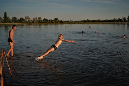 Some children bathe on the shores of the lake in Slovyansk.