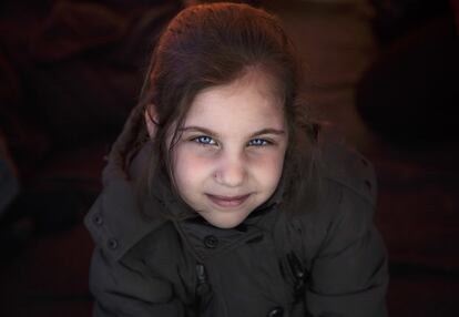 In this March 3, 2016 photo, Maria Al-Tawil, poses for a portrait inside her family's tent in Idomeni, Greece. Maria was born in Damascus just four months before the war in Syria broke out. She has experienced nothing but war, her mother Narjes Al Shalaby, 27, told the Associated Press. x93I have a lot of anxiety, she hasnx92t lived a good day in her life,x94 she said. (AP Photo/Vadim Ghirda)