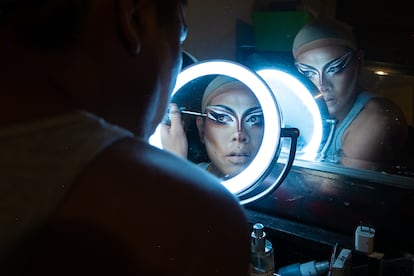 Gloria Deus applies makeup before leaving for a presentation in Guatemala City.