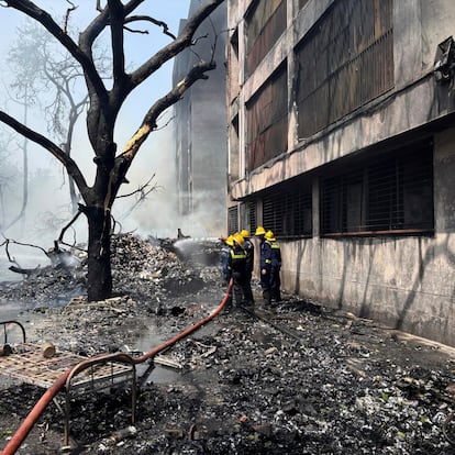 Firefighters work at the site of an airplane that crashed in India's northwestern city of Ahmedabad in Gujarat state, Thursday, June12, 2025. (AP Photo/Ajit Solanki)