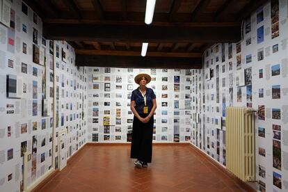 Photographer Marina Planas in a room of her installation. 